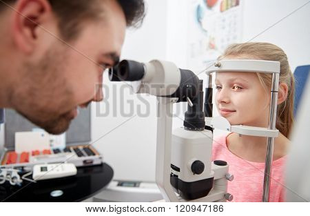 health care, medicine, people, eyesight and technology concept - optometrist with non contact tonometer checking patient intraocular pressure at eye clinic or optics store