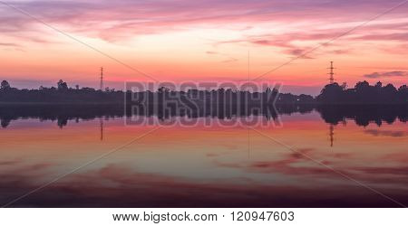 Huayyang Reservoir With Water Reflection At Sunset