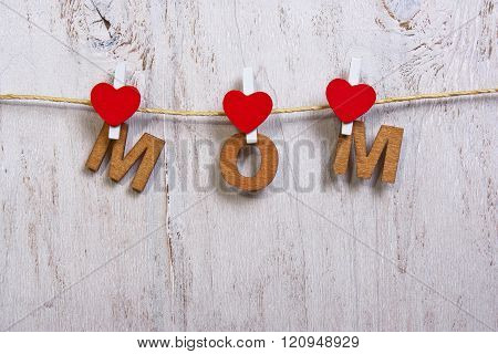 Wood Letters And Heart Forming Phrase Mom