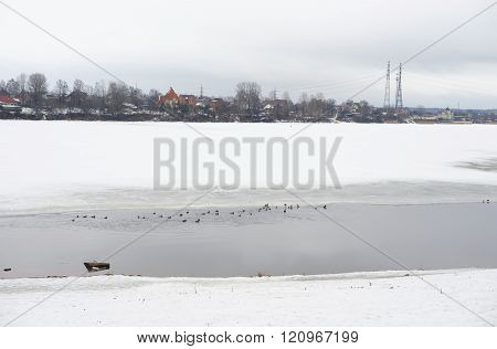 View of Neva River on the outskirts of St. Petersburg at cloud winter day Russia.