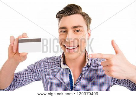 Attractive Cheerful Young Man Pointing On Bank Card
