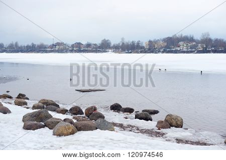View of Neva River on the outskirts of St. Petersburg at cloud winter day Russia.