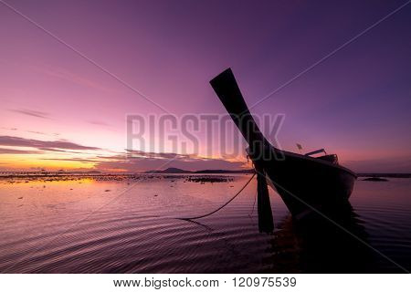 Long tail fishing boats at sunet in Thailand