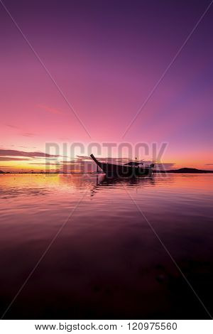 Long tail fishing boats at sunet in Thailand