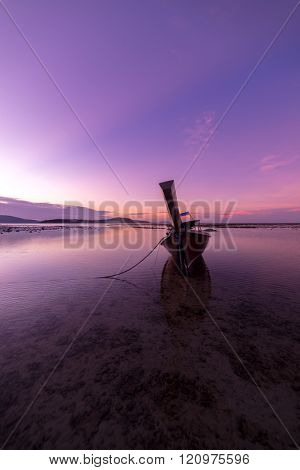 Long tail fishing boats at sunet in Thailand