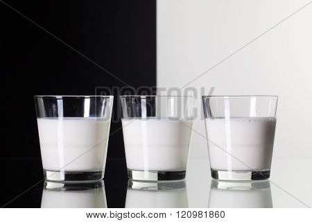 Glasses Of Milk   Isolated On Black And White Background