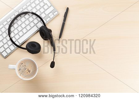 Office desk with headset and pc. Call center support table. Top veiw with copy space