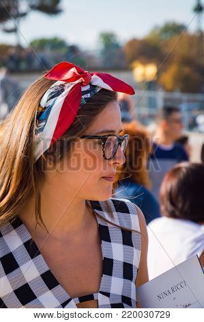 Stylish european woman in the Tuileries Garden. Paris Fashion Week: Ready to Wear 2014-2015 is held from September 25 to October 1, 2014. France, Paris, September, 25, 2014
