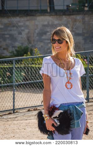 Stylish european woman in the Tuileries Garden. Paris Fashion Week: Ready to Wear 2014-2015 is held from September 25 to October 1, 2014. France, Paris, September, 25, 2014