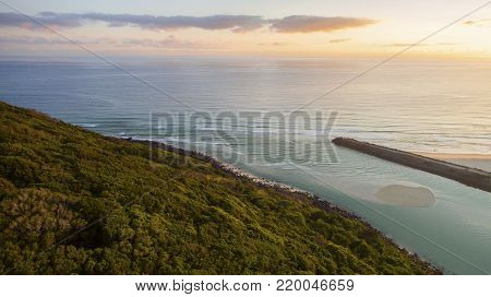 Aerial view over Burleigh Headland and Tallebudgera Creek entrance and sunrise