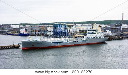 GOTHENBURG, SWEDEN - MAY 16, 2017: The tanker ship Ternsund is docked near storage tanks in Gothenburg harbor.
