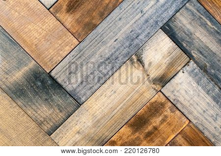 fragment of parquet paintings on the wall of the different types of wood.