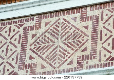 Closeup of architectural ornament. Stone carving of flower motif pattern