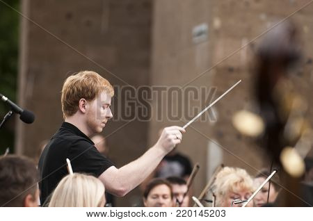 ROSTOV-ON-DON, RUSSIA - 10 SEPTEMBER 2017. Performance of the Rostov Academic Symphony Orchestra on the Public Library site. The conductor of orchestra. Matvienko Dmitry.