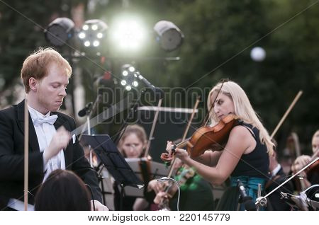ROSTOV-ON-DON, RUSSIA - 10 SEPTEMBER 2017. Performance of the Rostov Academic Symphony Orchestra on the Public Library site. The conductor of orchestra. Matvienko Dmitry.