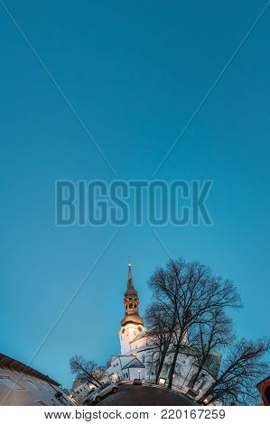 Tallinn, Estonia. Funny Panorama Like Little Planet Of Famous Landmark Cathedral Of Saint Mary The Virgin Or Dome Church Or Toomkirik In Street Lighting At Evening Or Night Illumination.