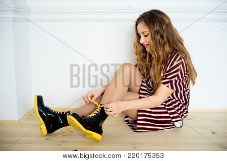 A portrait of a teen girl model in a stdio