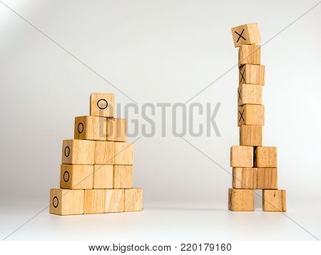 The Stacks Of Rectangular Wooden Cubes To Be Two Stacks, One High And The Other Short
