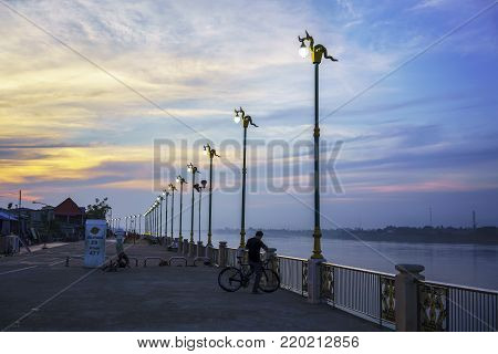 Nong Khai ,Thailand - December 25 , 2017 : Atmosphere at Tha Sadet promenade along Mekong river in the evening