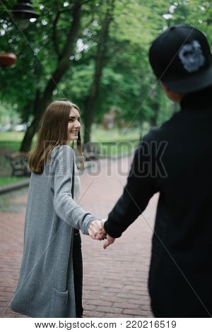 lovely cople  running and play in city park