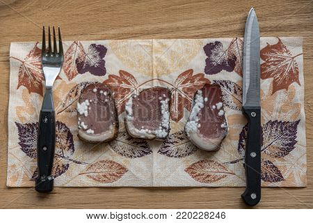 bacon served at the table, spoiled by mold