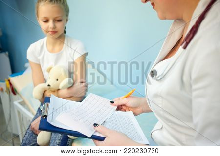 Doctor holding an electrocardiogram