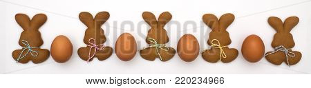 Easter cookies isolated on white background. Easter baking. Making gingerbread easter cookies. Easter concept.