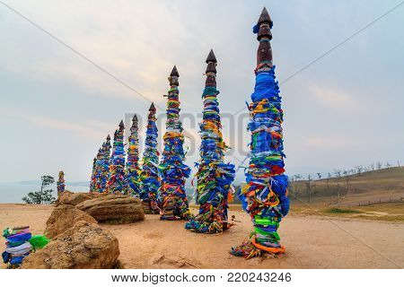 Wooden Ritual Pillars With Colorful Ribbons Hadak On Cape Burkhan. Lake Baikal. Olkhon Island. Russi