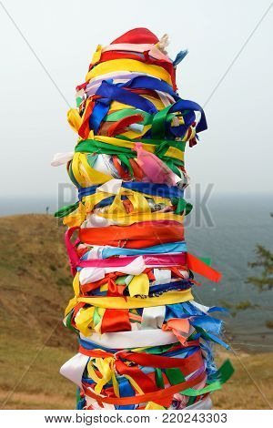 Wooden Ritual Pillars With Colorful Ribbons Hadak On Cape Burkhan. Lake Baikal. Olkhon Island. Russi