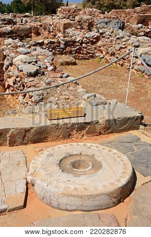 MALIA, CRETE - SEPTEMBER 14, 2016 - Ancient offering table at the Minoan Malia ruins archaeological site, Malia, Crete, Greece, Europe, September 14, 2016.