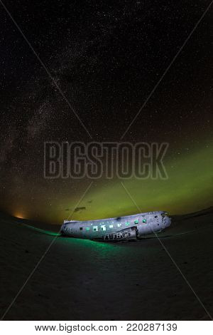 Solheimasandur plane wreck with active norhtern lights, Iceland, Europe.