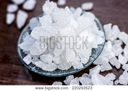 Rock Sugar Or Sugar Cubes In A Glass Plate On Wooden Surface.