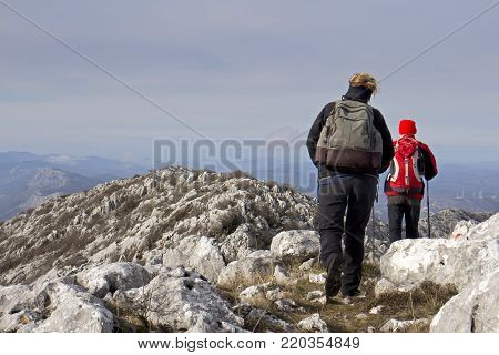 Woman and man climbing ridge of Mosor mountain in Croatia