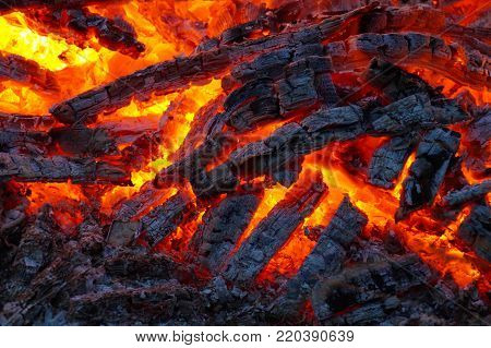 Glowing bonfire, high temperature, many shades of red