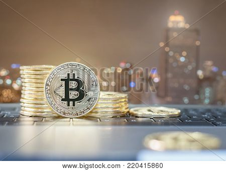 Bitcoin cryptocurrency gold stack coins of virtual digital currency for fintech financial banking business and world stock exchange investment via internet online computer technology concept
