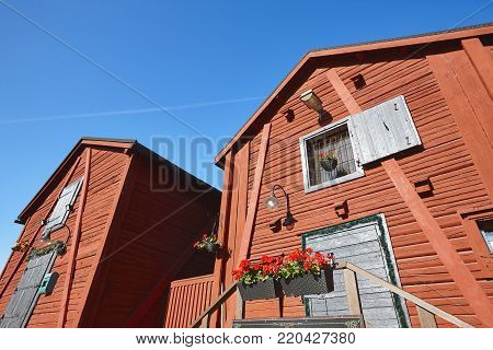 Red wooden houses in Oulu city center. Finland highlight destination