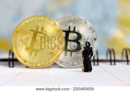 Miniature: Demon Of Death Standing With Bitcoin. Financial And Business Concept.