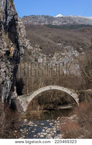 Amazing landscape of Bridge of Kontodimos or Lazaridis in Vikos gorge and Pindus Mountains, Zagori, Epirus, Greece