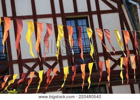 Exterior facade of a typical brittany house with wooden beams and streamers at the forefront