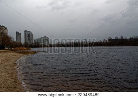 Autmn lake landscape, windy weather, cityscape area