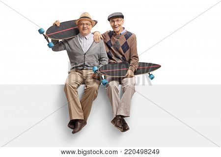 Seniors with longboards sitting on a panel isolated on white background