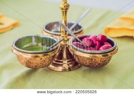 Colorful Green, Yellow And Red Spicy Sauces In Bowls
