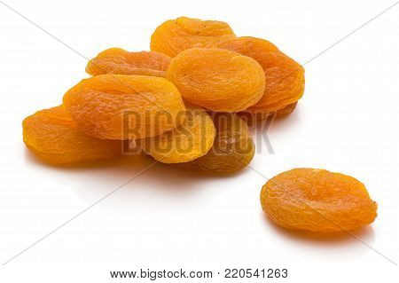 Orange dried apricots isolated on white background