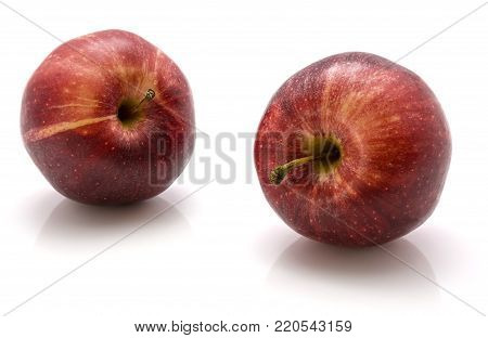 Pair of whole Gala apples isolated on white background