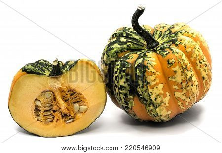 One whole spotted green yellow pumpkin and one half isolated on white background