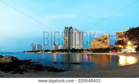 PATTAYA, CHONBURI, THAILAND: Pattaya City beach and sea in twilight time with colorful lights at Pattaya, Chonburi, Thailand.