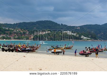 RAWAI BEACH, PHUKET ISLAND, THAILAND - FEBRUARY 28, 2016: long tailed boat at exotic Bay of Rawai in Phuket island Thailand