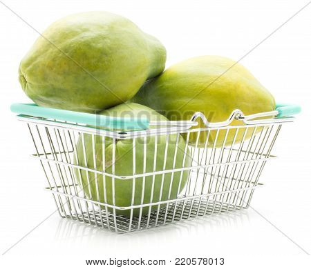 Green papaya (pawpaw, papaw) in a shopping basket isolated on white background three fresh