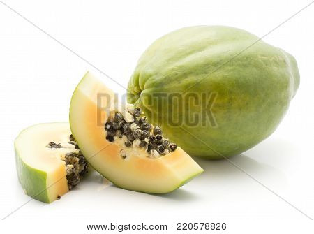 Green papaya (pawpaw, papaw) isolated on white background one whole and two slices orange flesh with seeds