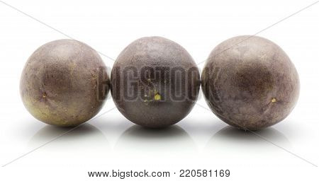 Three passion fruits in row isolated on white background